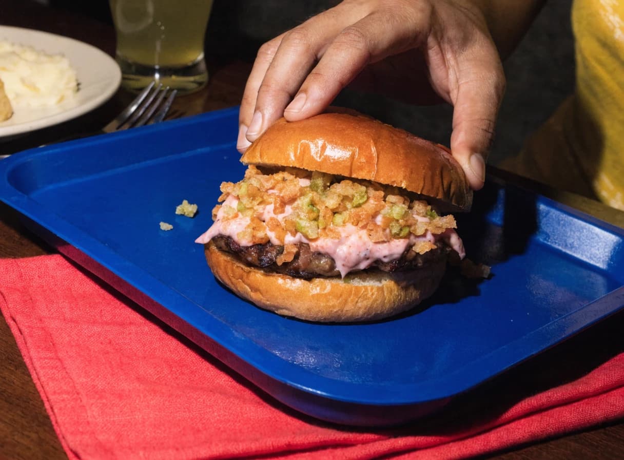 Kimchi crunch burger served in colorful paper