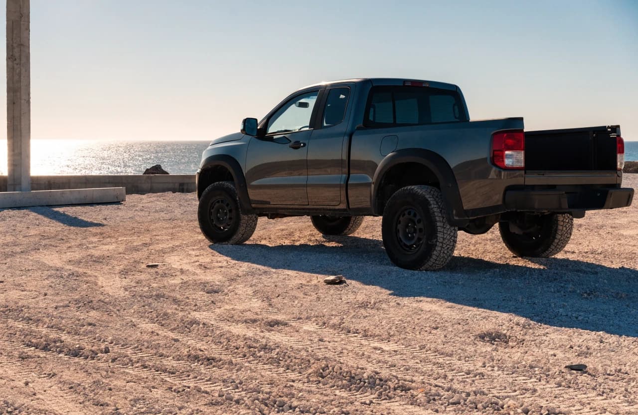 Modern pickup truck in a fictional dealership photo