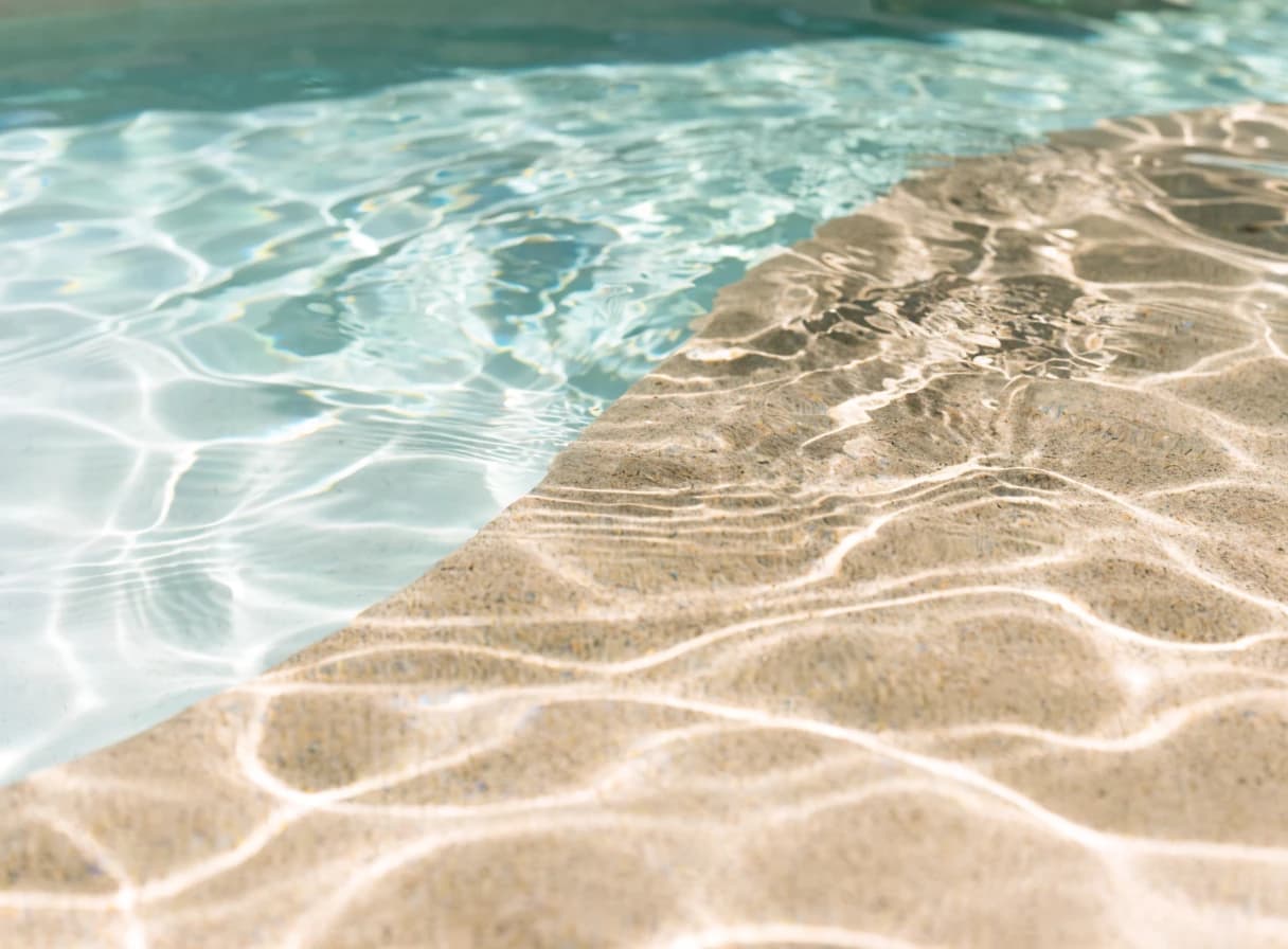 Sand-toned pool plaster texture