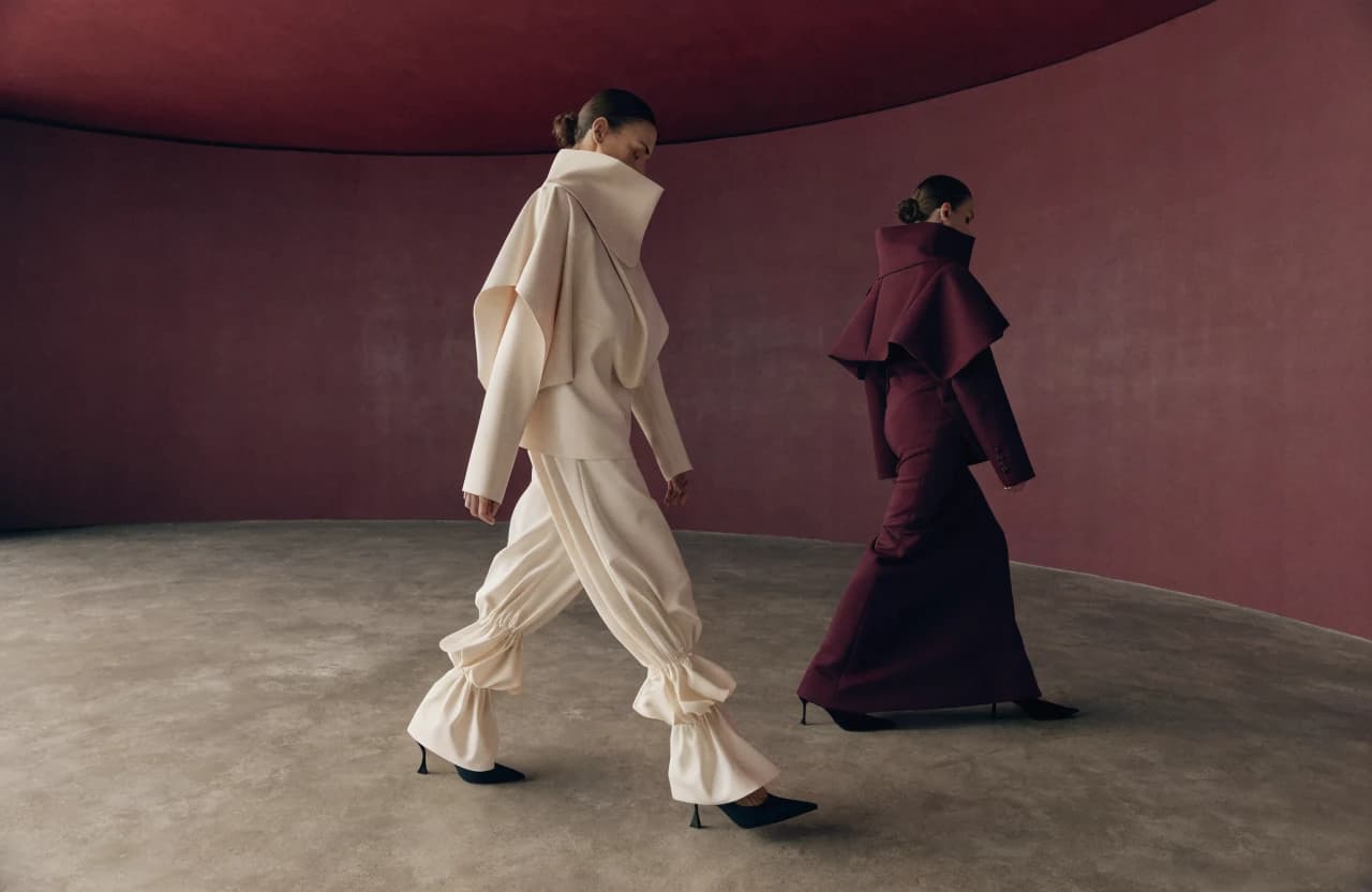 Fashion collection photographed in a deep burgundy room