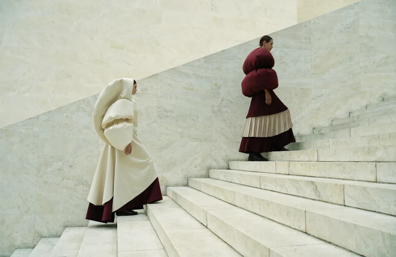 Tailored fashion look on a monumental stone staircase