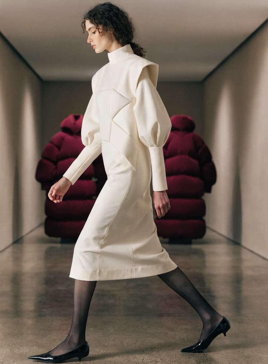 Fashion look in a long gallery corridor