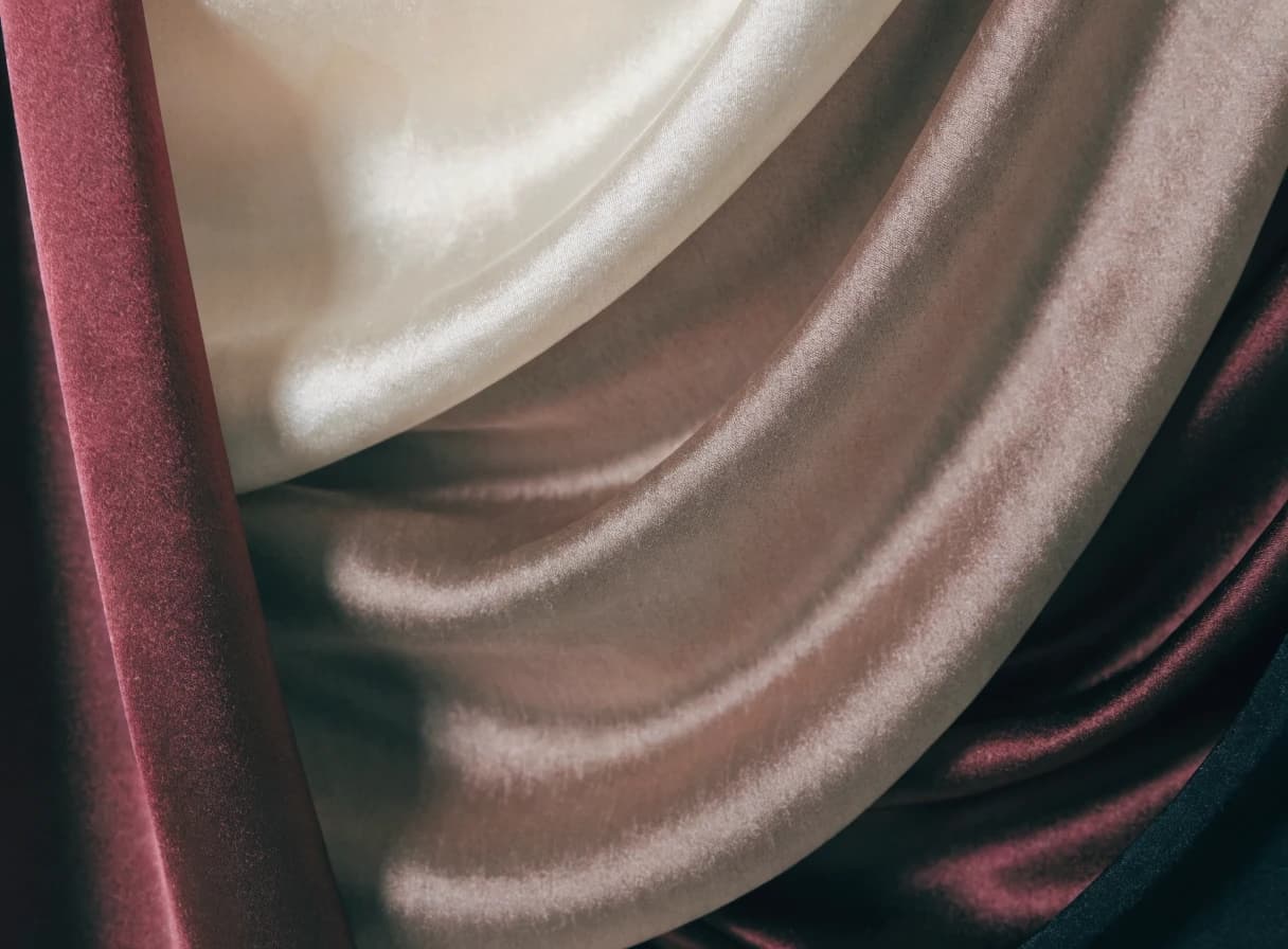 Close view of softly folded taupe silk