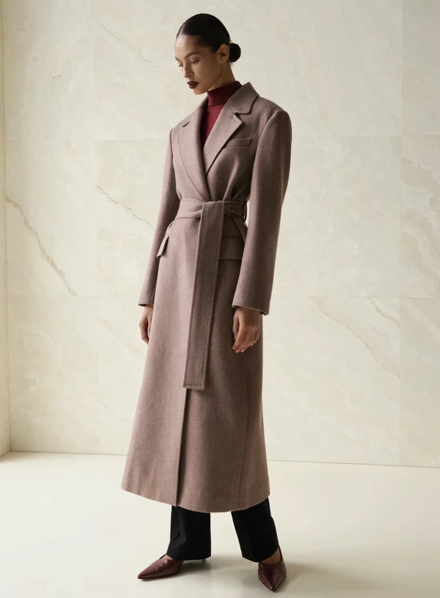 Tailored burgundy coat from the fictional Veloura collection