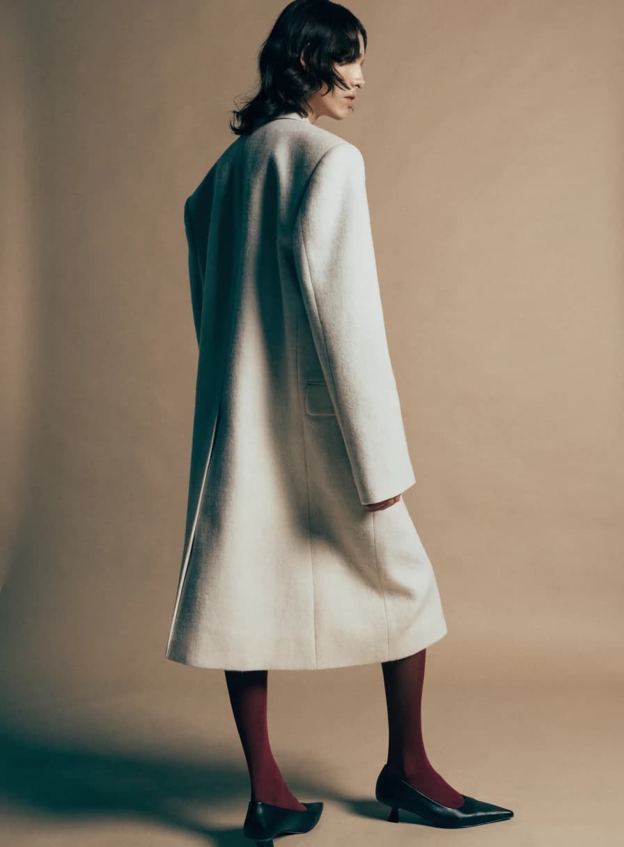 Minimal wool blazer from the fictional Veloura collection
