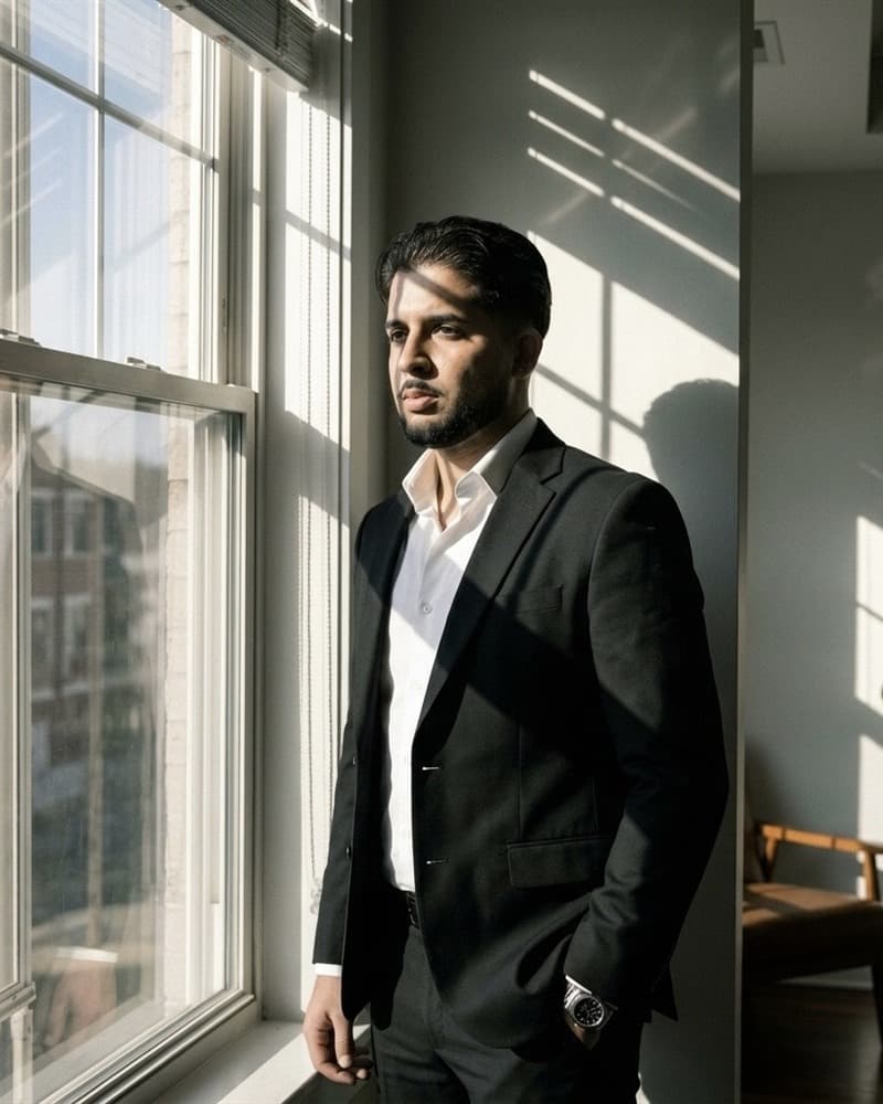Yhorman Ibarra, Founder and Lead Developer of studiogecko.dev, standing beside an office window